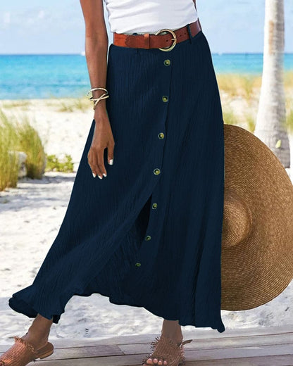 Deze elegante lange rok is geschikt voor diverse gelegenheden en biedt een comfortabele en stijlvolle look. De rok heeft een eenvoudige A-lijn silhouet, een effen kleur en een trendy maxi-lengte. Gemaakt van een katoenmix en polyester.