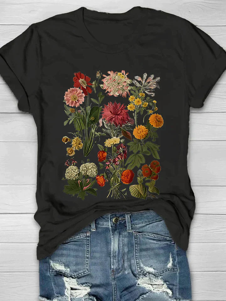 Vintage T-shirt met bloemenprint, perfecte combinatie van comfort en trendy stijl. Ideaal voor diverse gelegenheden en ontworpen voor bewegingsvrijheid.