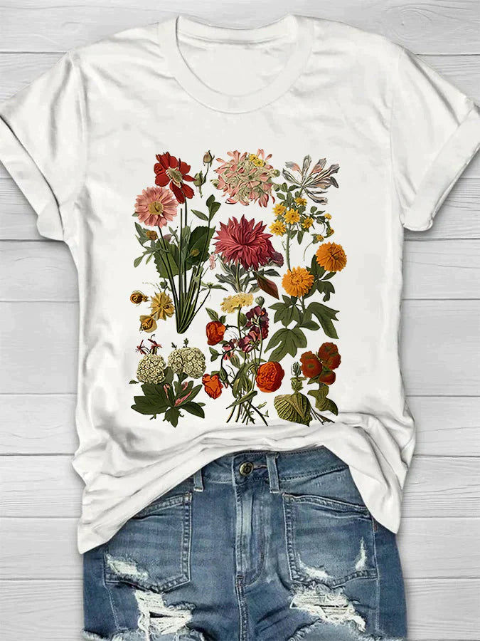 Vintage T-shirt met bloemenprint, perfecte combinatie van comfort en trendy stijl. Ideaal voor diverse gelegenheden en ontworpen voor bewegingsvrijheid.